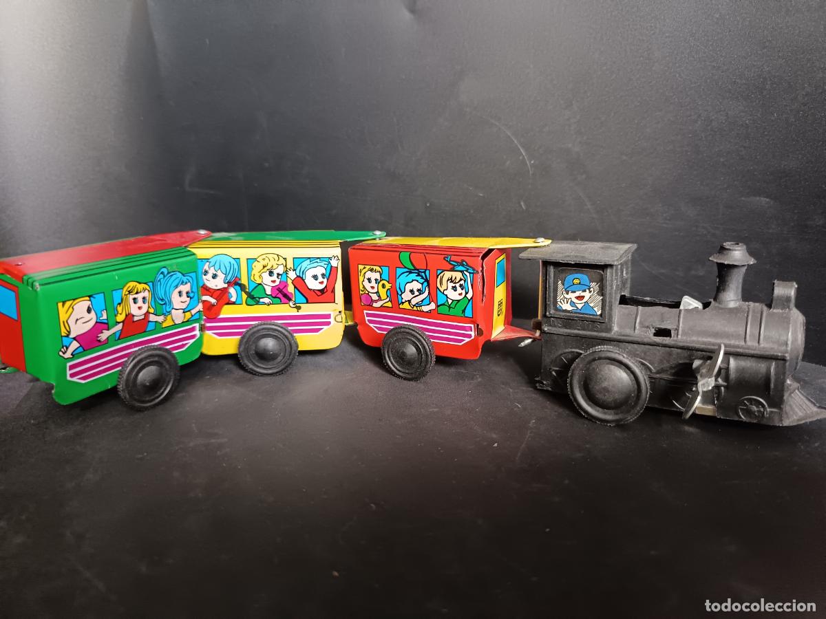 Tin Toys: TREN de juguete mec&aacute;nico de cuerda de Hojalata litografiada. Funcionando 28 centimetros largo todo.