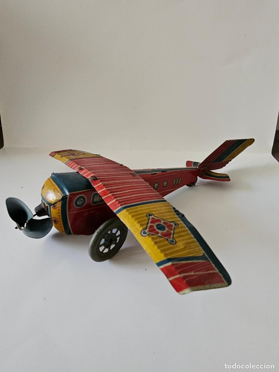 Brinquedos antigos de folha-de-Flandres: Avi&oacute;n de hojalata de Pay&aacute; rojo, ref. 606, a&ntilde;os 40