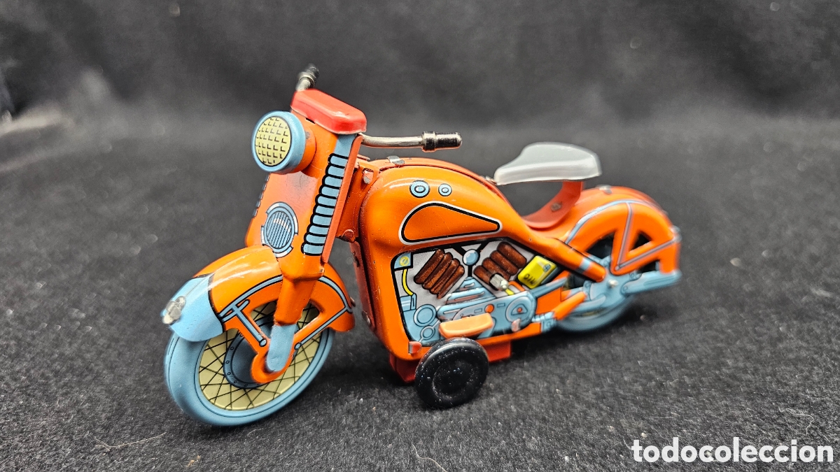 Antikes Blechspielzeug: moto de juguete de hojalata a cuerda de estilo retro