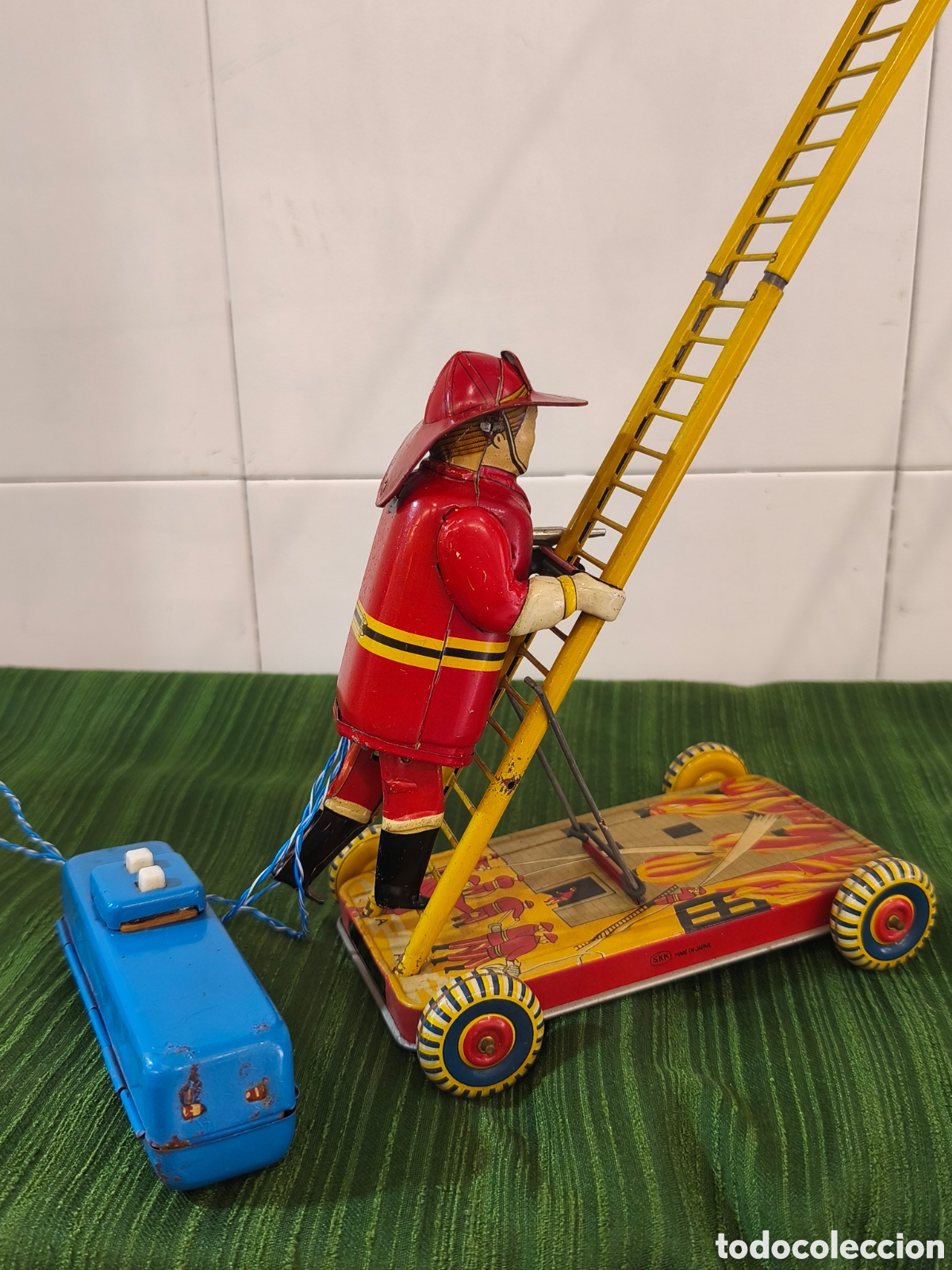 Jouets anciens en fer-blanc: Sonsco bombero de hojalata, sube la escalera, funciona
