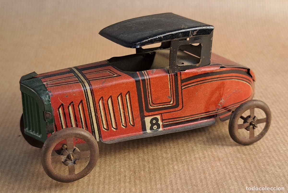 Juguetes antiguos de hojalata: Coche de carreras antiguo de hojalata Rico. Juguete vintage, mediados S. XX