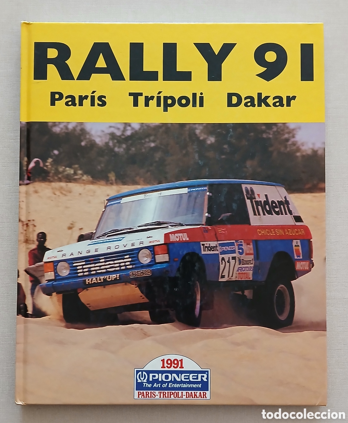 Coleccionismo deportivo: LIBRO RALLY PARIS TRIPOLI DAKAR 1991 PIONEER GRAN FORMATO TAPA DURA MOTOR AUTOMOVILISMO RAIDS