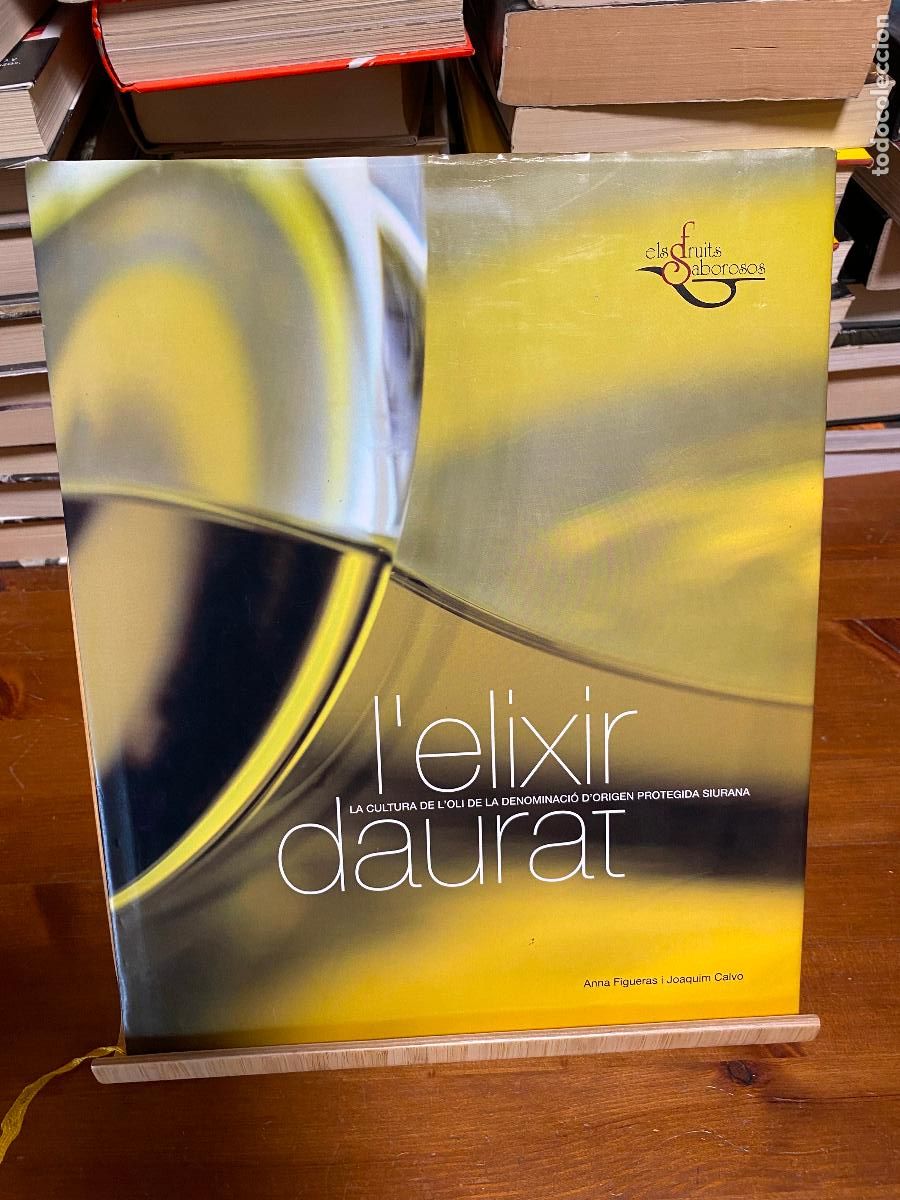 Libros de segunda mano: L'ELIXIR DAURAT. LA CULTURA DE L'OLI DE LA DENOMINACI&Oacute; D'ORIGEN SIURANA. A. FIGUERAS I J. CALVO.