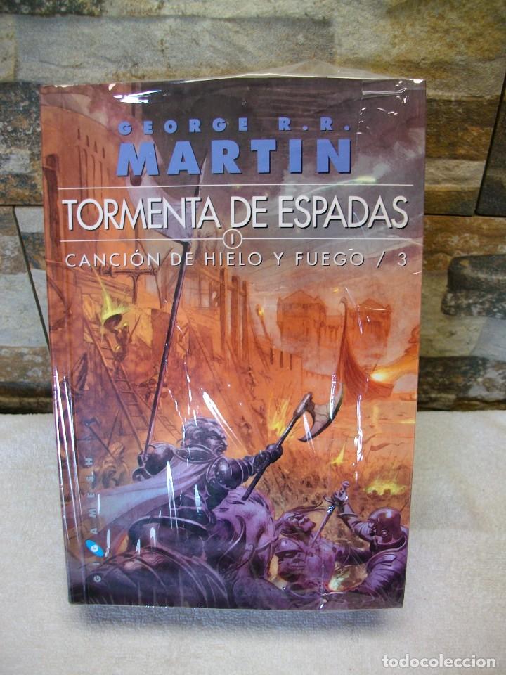 Second hand books: TORMENTA DE ESPADAS CANCION DE HIELO I