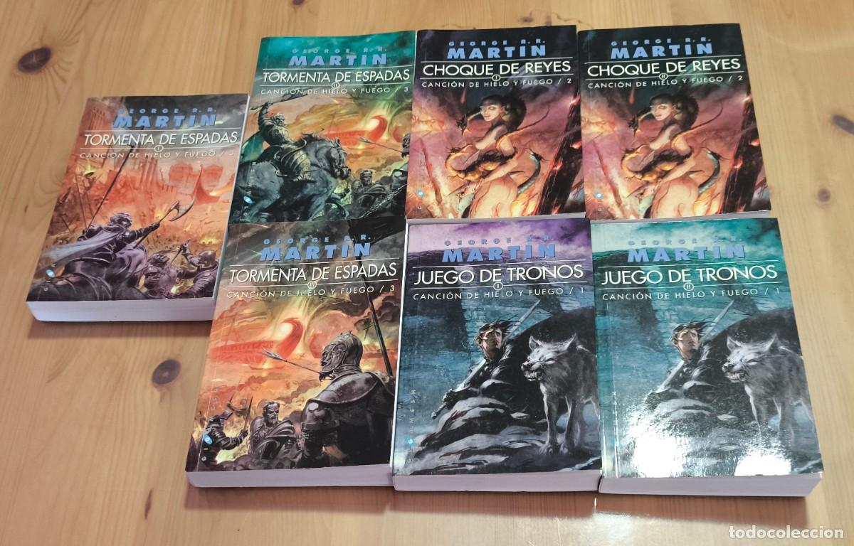 Libros de segunda mano: JUEGO DE TRONOS GEORGE R R MARTIN , LOTE 7 LIBROS , CANCION DE HIELO Y FUEGO TORMENTA DE ESPADAS