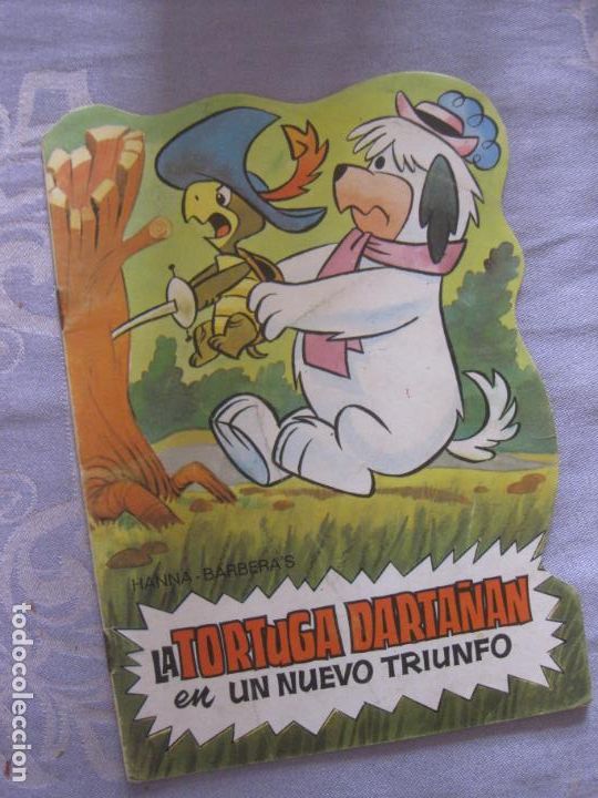 Libros de segunda mano: LA TORTUGA DARTA&Ntilde;AN EN UN NUEVO TRIUNFO. TROQUELADOS TELE COLOR.
