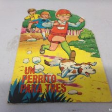 Libros de segunda mano: CUENTO TROQUELADO UN PERRITO PARA TRES CUENTOS TORAY 1969. Lote 367451649