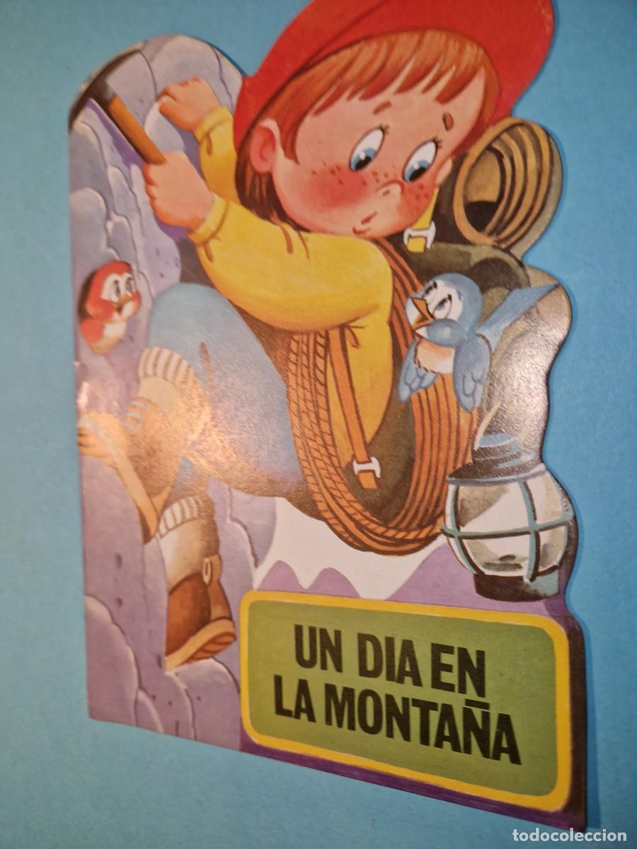 Libros de segunda mano: UN DIA EN LA MONTA&Ntilde;S BRUGUERA 1984 - Foto 1