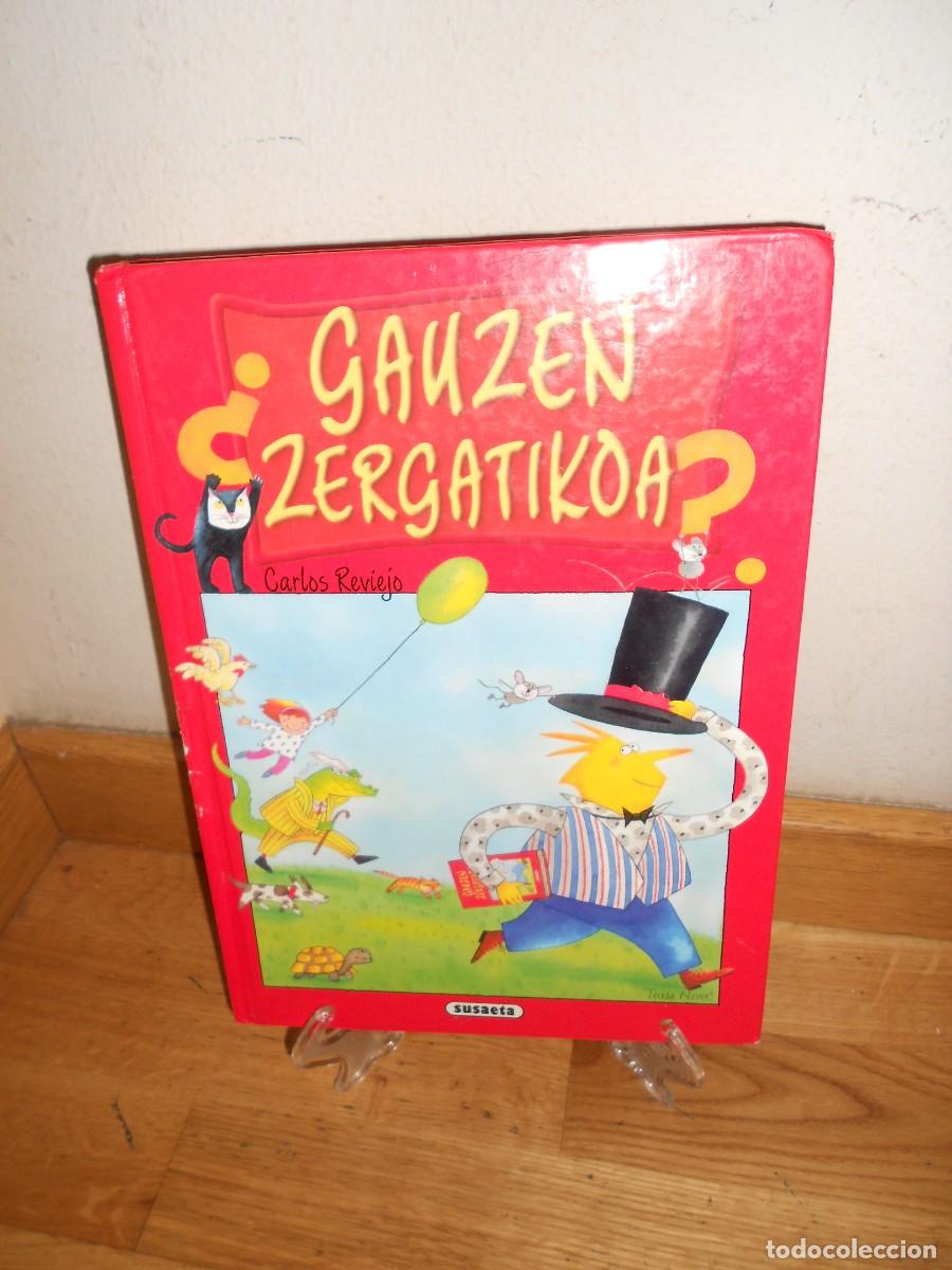 Libros de segunda mano: GAUZEN ZERGATIKOA 100 gardera eta erantzun baino gehiago / CUENTOS en EUSKERA CARLOS REVIEJO - 1&euro;y+