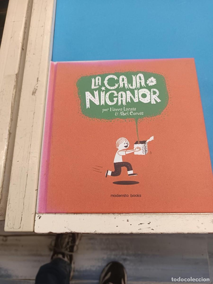 Libros de segunda mano: LA CAJA NIGANOR ELENA LACASA Y ABEL CUEVAS EDICIONES MODERNITO BOOKS