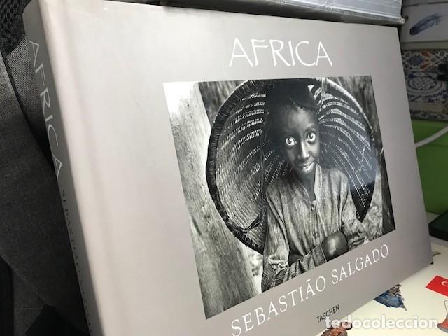 Libros de segunda mano: SEBASTIAO SALGADO - AFRICA. TASCHEN, 2007 - Texto Mia Couto