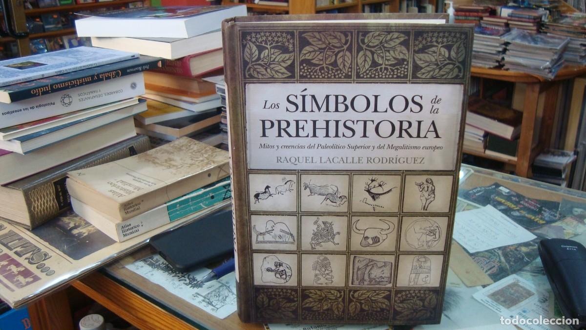 Libros de segunda mano: LOS S&Iacute;MBOLOS DE LA PREHISTORIA - Lacalle, Raquel
