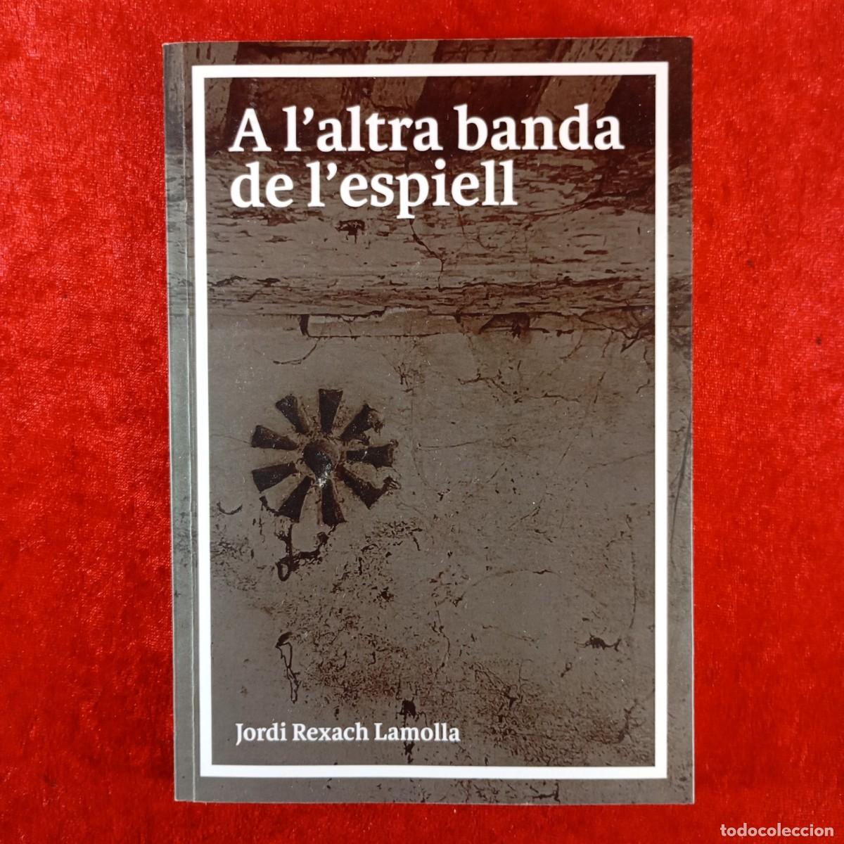 Libros de segunda mano: A L'ALTRA BANDA DE L'ESPIELL - JORDI REXACH LAMOLLA - DEDICADO POR EL AUTOR A JOAN VI&Ntilde;AS / 3810