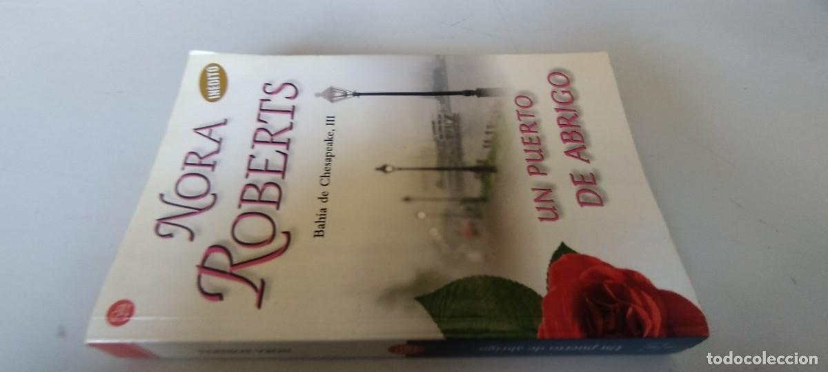 Libros de segunda mano: UN PUERTO DE ABRIGO / NORA ROBERTS / EVA 202 / ROMANTICA