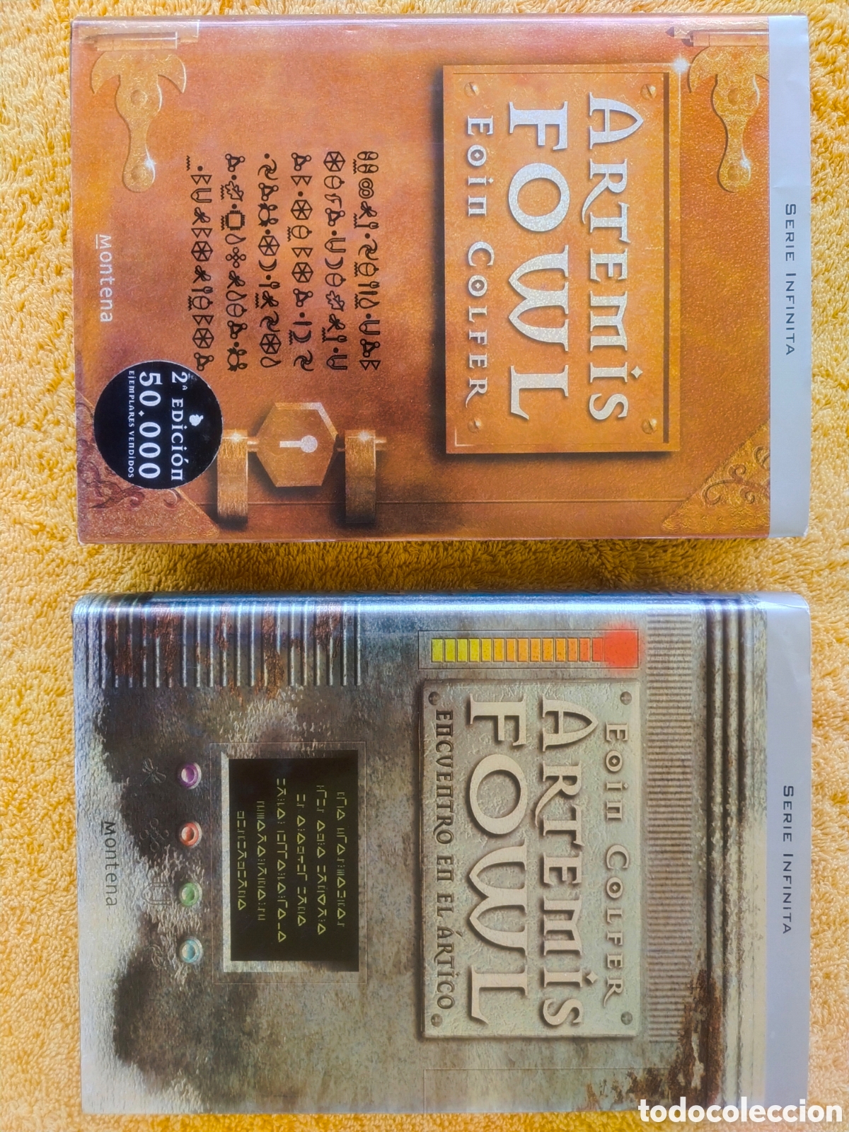 Libros de segunda mano: Pack 2 Libros Artemis Fowl 1 y 2 Encuentro en el &Aacute;rtico Eoin Colfer Tapa Dura Montena Serie Infinita