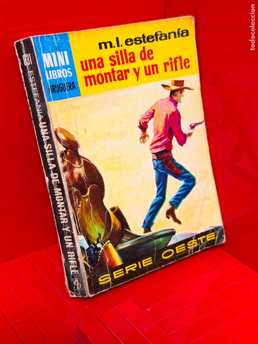 Libros de segunda mano: UNA SILLA DE MONTAR Y UN RIFLE - M.L. ESTEFANIA - ED. BRUGUERA - MINI LIBROS BRUGUERA - No 831