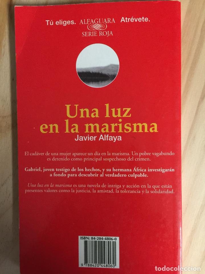 Libros de segunda mano: UNA LUZ EN LA MARISMA - Javier Alfaya - Foto 1