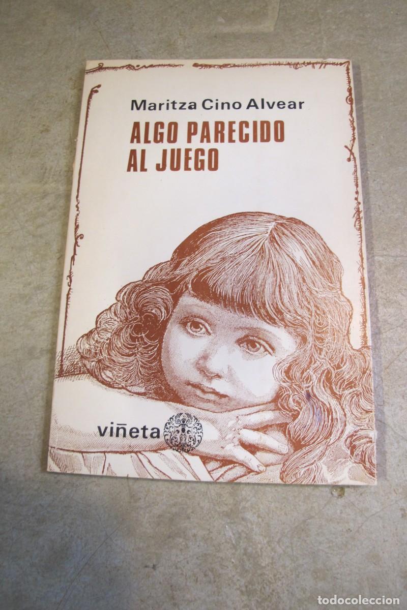 Livros em segunda m&atilde;o: ALGO PARECIDO AL JUEGO. MARITZA CINO ALVEAR. POESIA. DEDICADO POR ESCRITORA. GUAYAQUIL ECUADOR