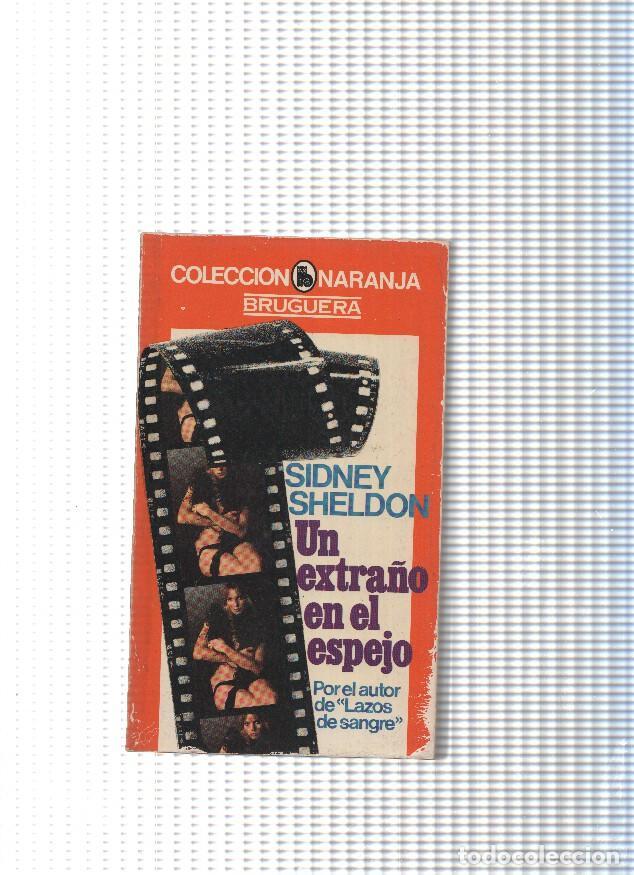 Libros: Un extra&ntilde;o en el espejo - Sidney Sheldon - Foto 1