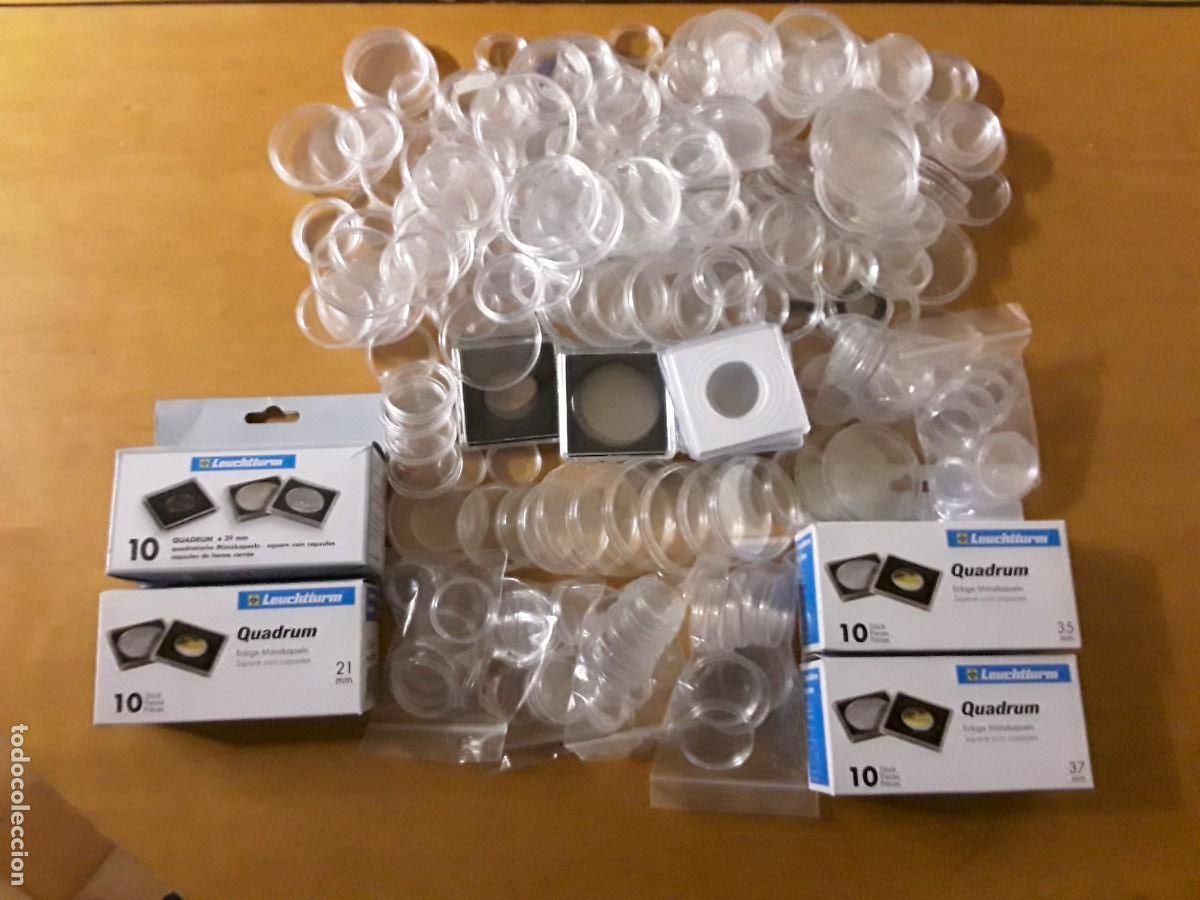 Material numism&aacute;tico: LOTE CAPSULAS NUEVAS Y USADAS EN BUEN ESTADO. CAJAS DE CAPSULAS QUADRUM NUEVAS. CASI 300 CAPSULAS.