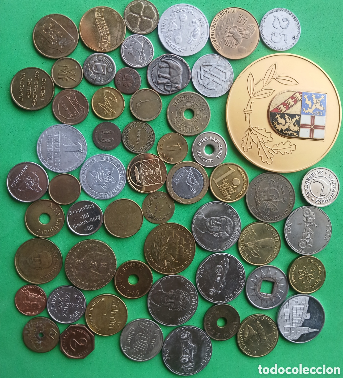 Materiale numismatico: Lote 55 token/ fichas o medallas diferentes