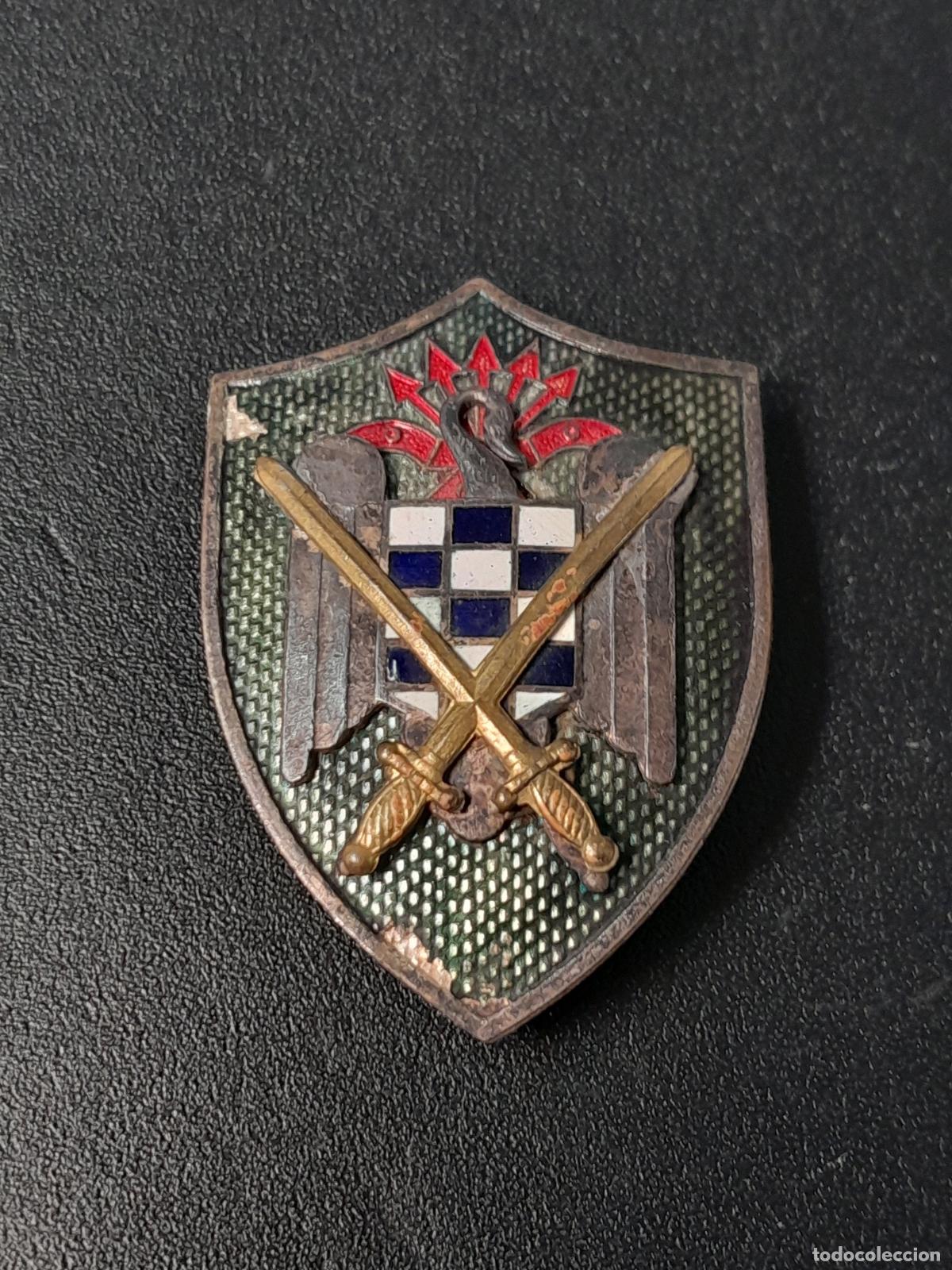Medaglie condecorativas: M-2183. INSIGNIA ESCUDO DE LAS MILICIAS UNIVERSITARIAS. MEDIADOS S.XX