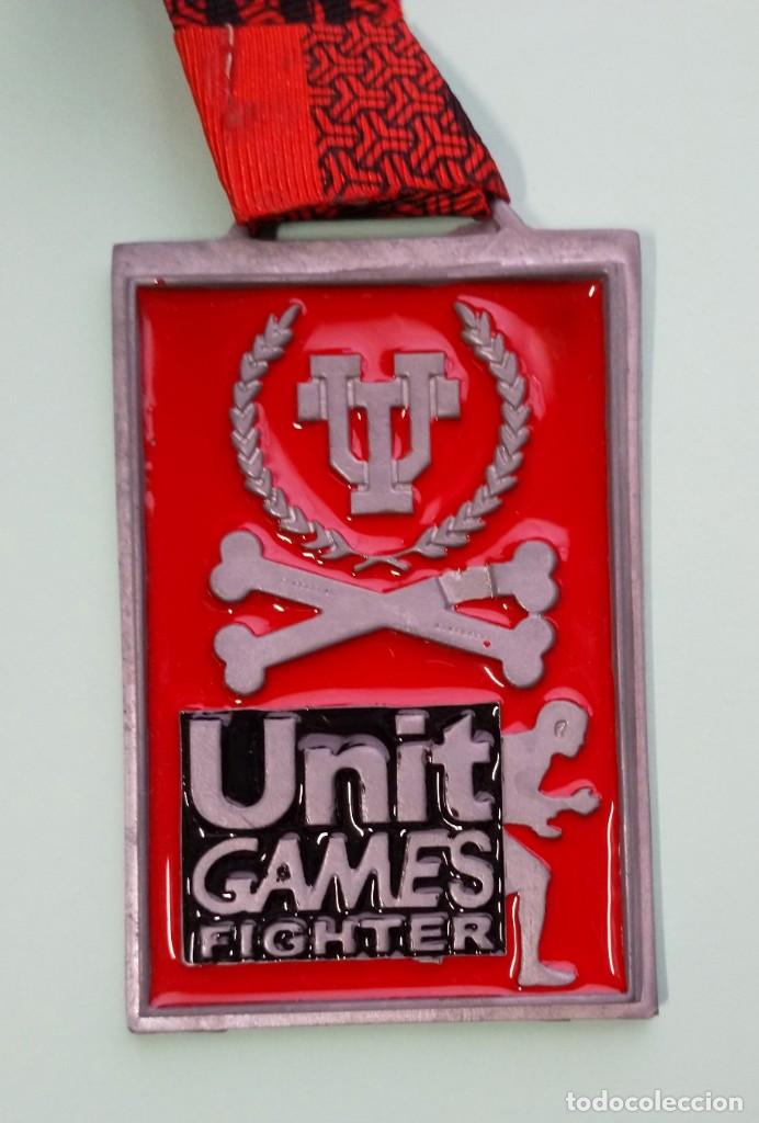 Coleccionismo deportivo: MEDALLA ROJA UNIT GAMES 4 FIGHTER