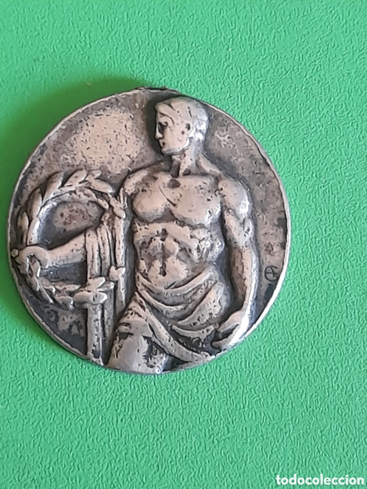 Colecionismo desportivo: Antigua medalla de plata de club de nataci&oacute;n de 1935, mide 25 mm de di&aacute;metro