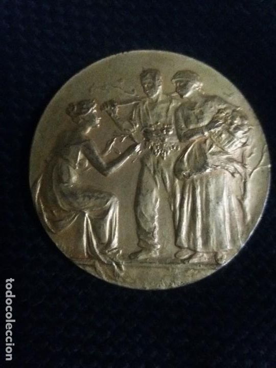 Medaglie storiche: Bonita medalla de bronce dorado