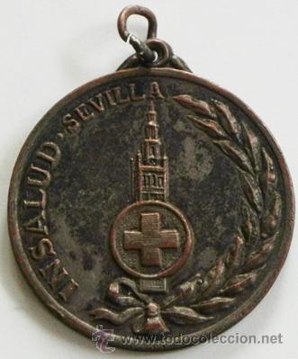 Medalhas tem&aacute;ticas: ANTIGUA MEDALLA DEL INSALUD SEVILLA PEQUE&Ntilde;A - GIRALDA Y CRUZ &iquest;CRUZ ROJA ?- METAL DIF&Iacute;CIL CONSEGUIRLA