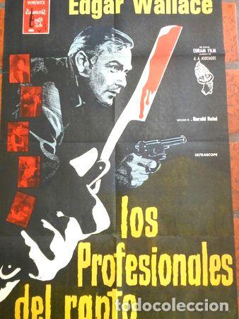 Medaglie tematiche: afiche de pelicula los profesionales del rapto