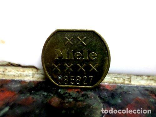 Medallas tem&aacute;ticas: ficha token miele lavadora maquina automatica diseno a