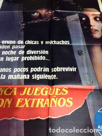 Medallas tem&aacute;ticas: poster steephen hopkins nunca juegues con extranos 1988