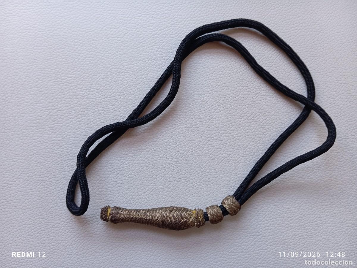 Militaria: Antigua dragona o fiador de sable