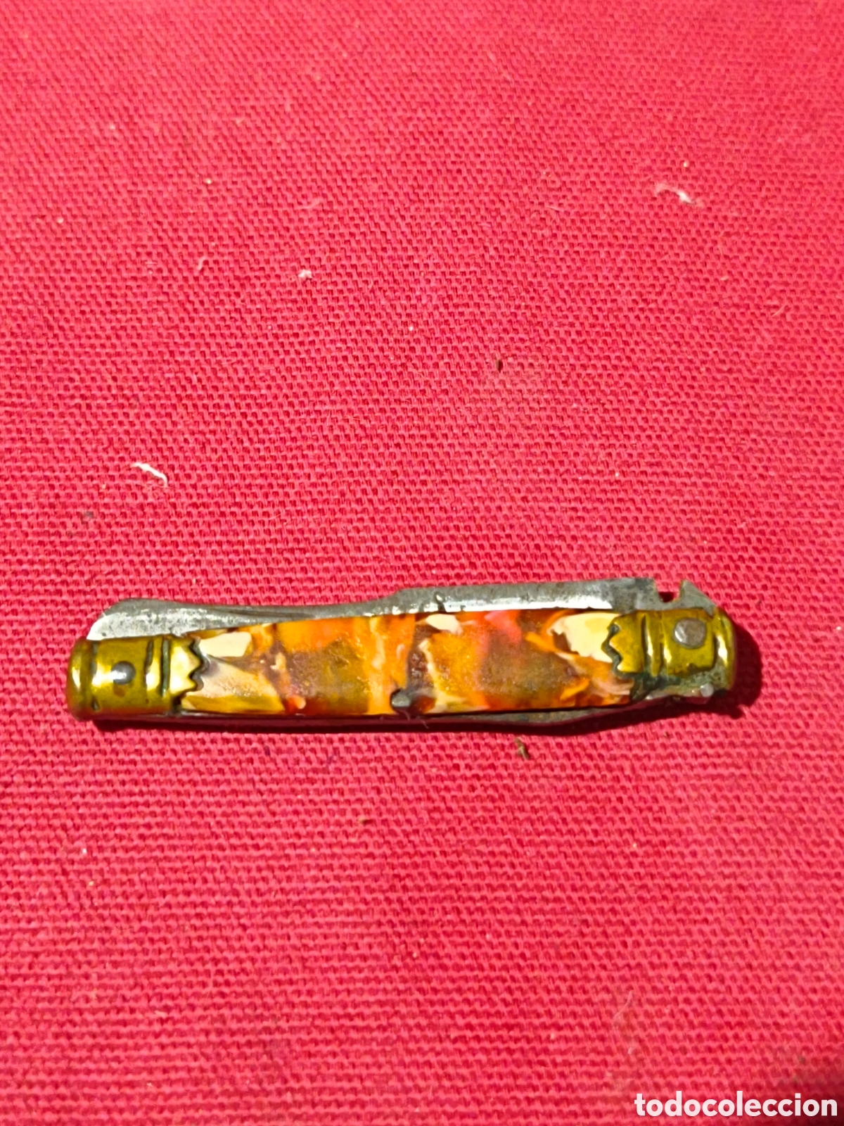 Militaria: Peque&ntilde;a navaja con cachas s&iacute;mil carey