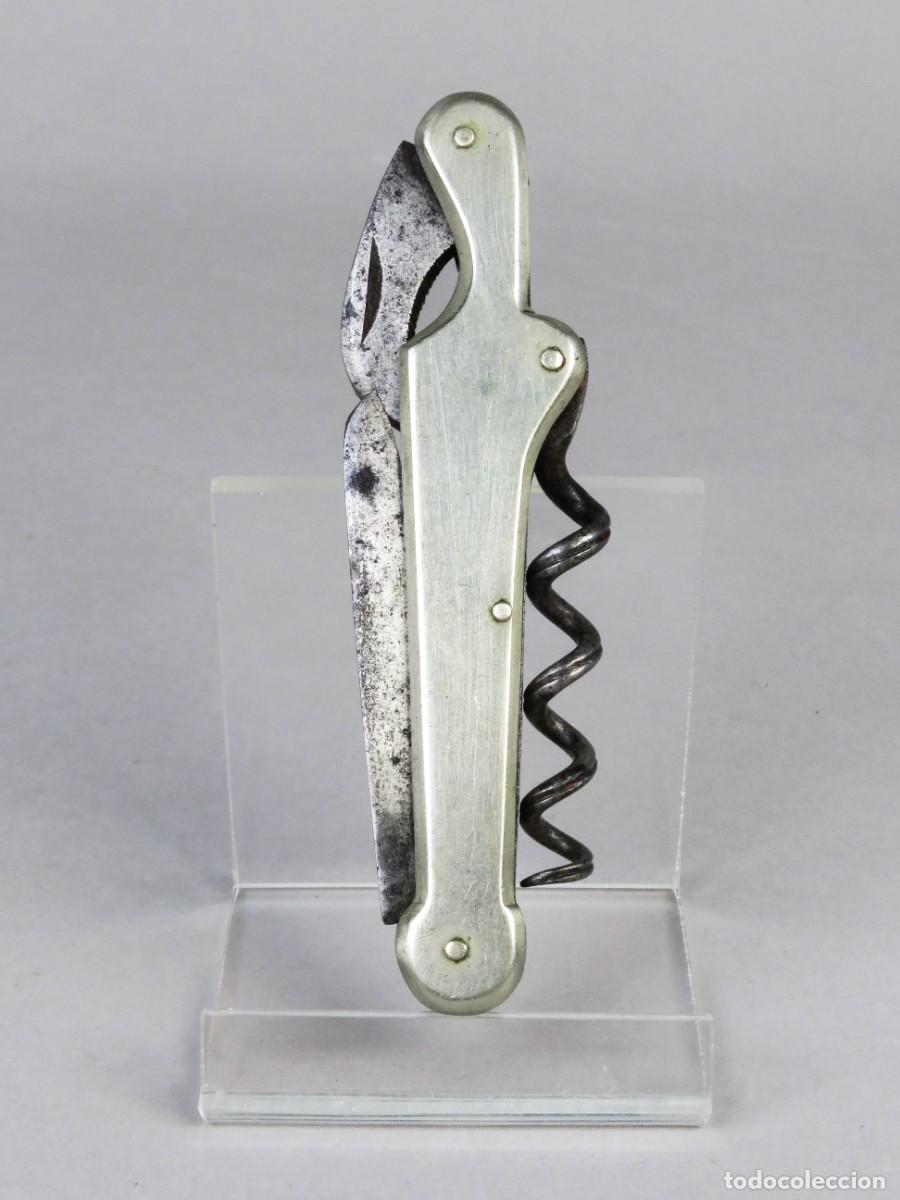 Militaria: Navaja multiusos cachas en metal blanco y sacacorchos finales siglo XIX