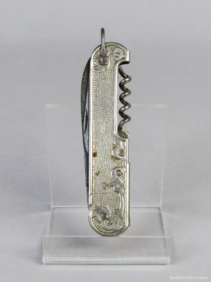 Militaria: Navaja multiusos PAYA con cachas de acero con relieve floral y sacacorchos siglo XX