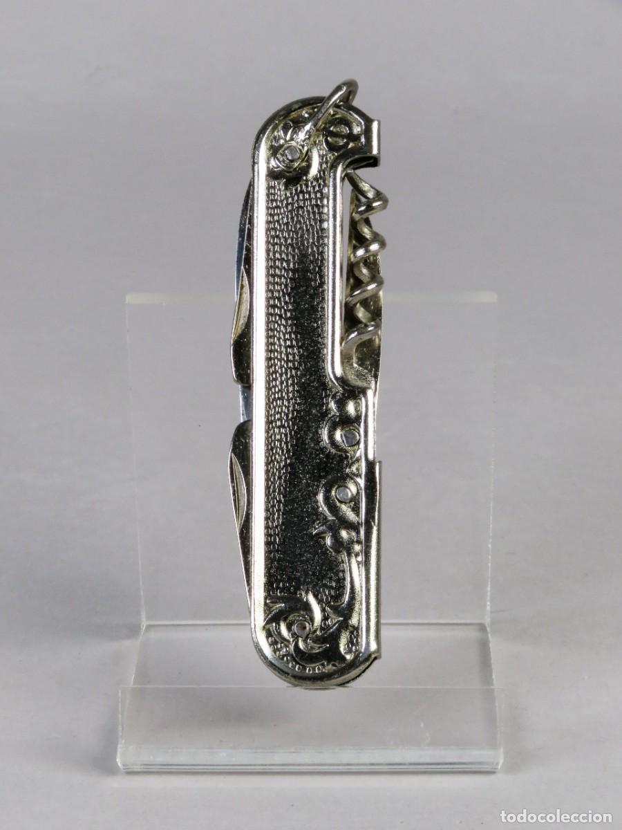 Militaria: Navaja multiusos posiblemente PAYA en metal con relieve floral y sacacorchos a&ntilde;os 40