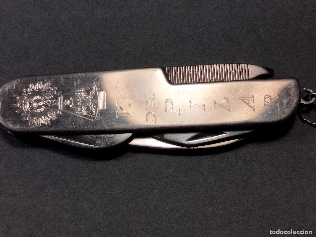 Militaria: FAC 17. NAVAJA TODO METAL TIPO SUIZA 5 POSICIONES. ADORNO VIRGEN DEL PILAR. BUENA CALIDAD.