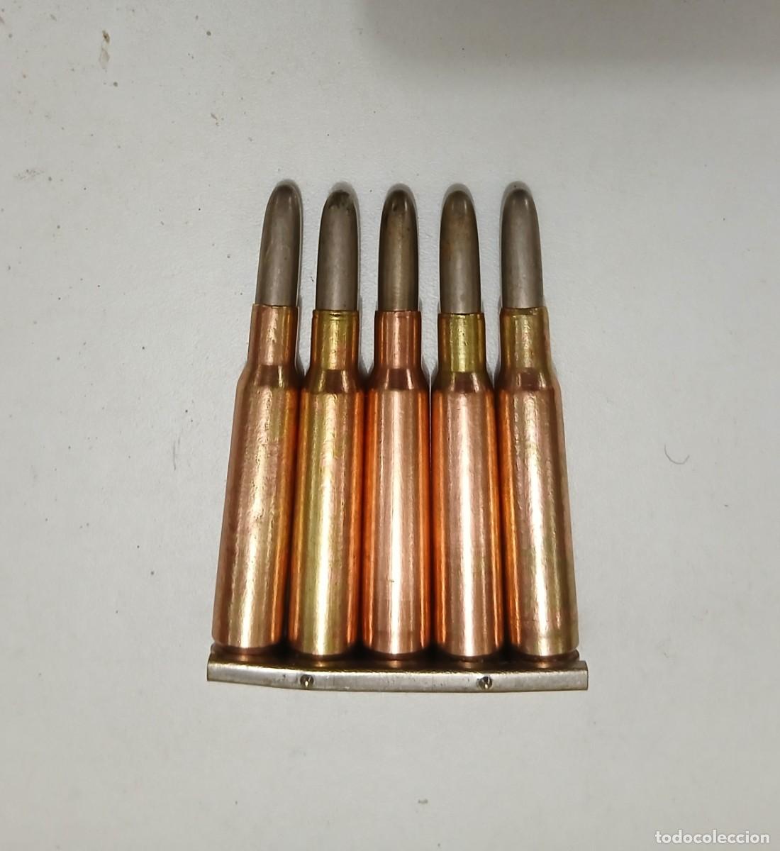 Militaria: Peine 7 mm Mauser mejicano con 5 cartuchos INERTES y percutidos. Guerra Civil.