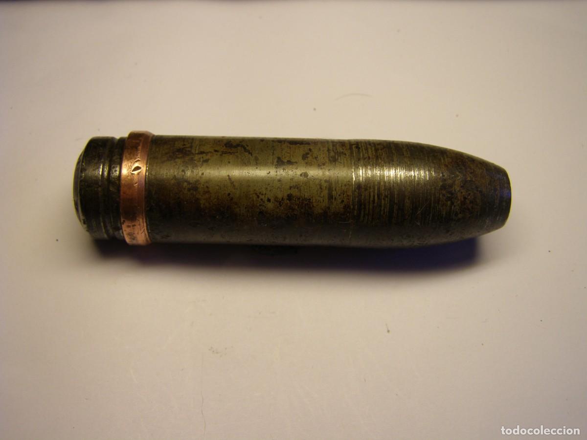 Militaria: Proyectil calibre 20 mm. oerlikon, Guerra Civil Espa&ntilde;ola, macizo. INERTE.