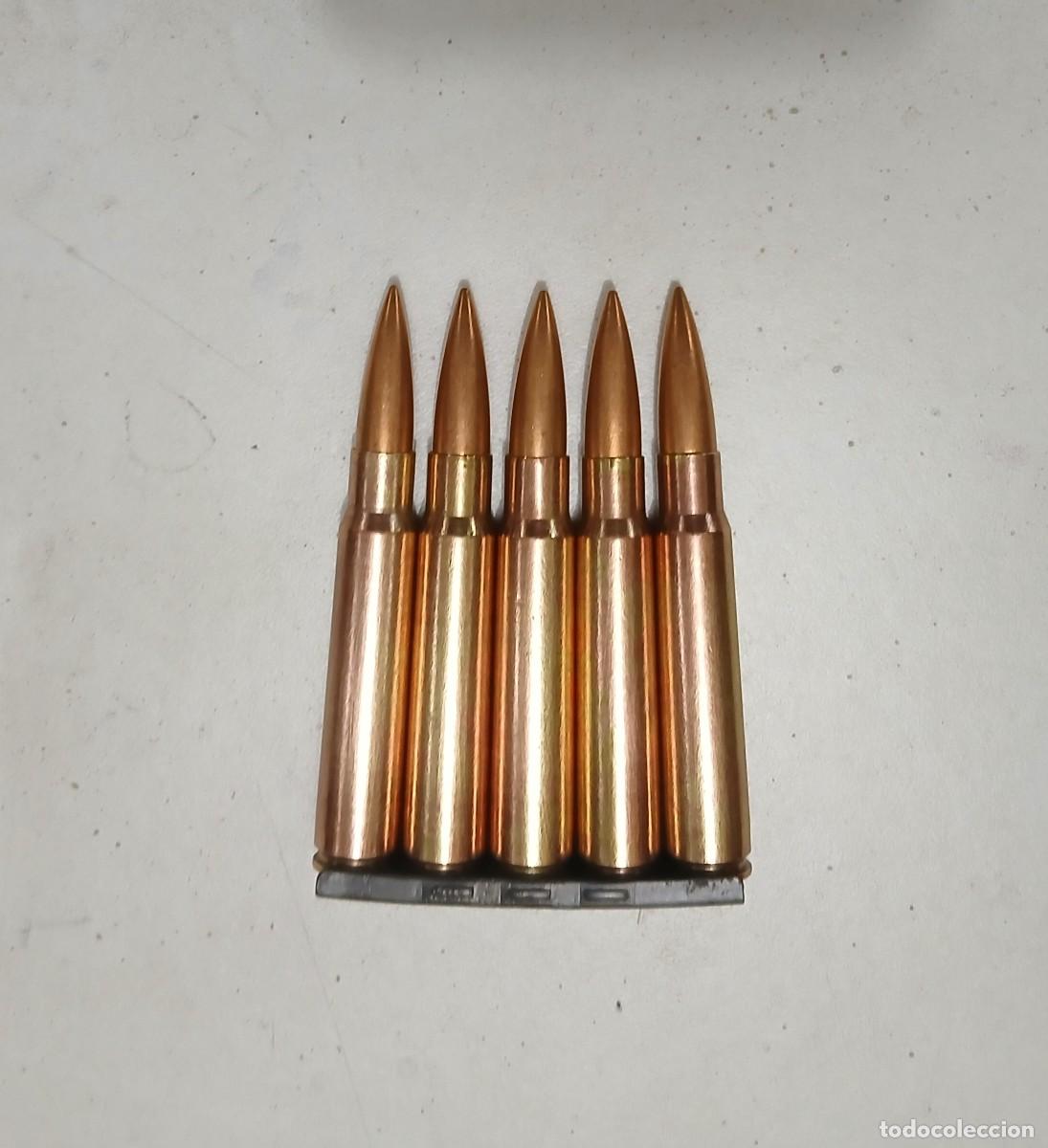Militaria: Peine alem&aacute;n con 5 cartuchos INERTES y disparados de 7,92 mm, guerra Civil.