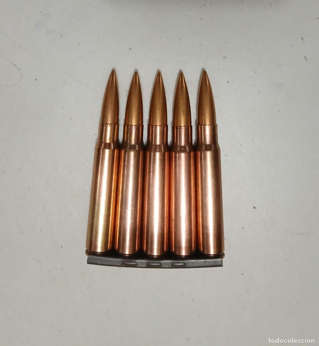 Militaria: Peine alem&aacute;n con 5 cartuchos INERTES y disparados de 7,92 mm, guerra Civil.