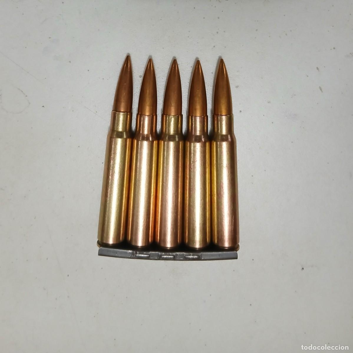 Militaria: Peine alem&aacute;n con 5 cartuchos INERTES y disparados de 7,92 mm, guerra Civil.