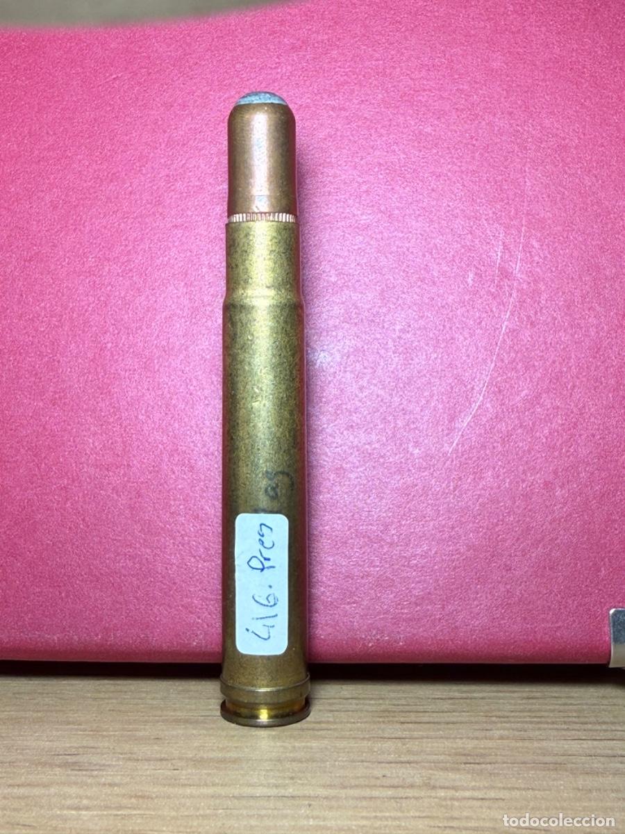 Militaria: .416 Rem Magnum Sobre Presi&oacute;n, calibre deportivo Inerte para colecci&oacute;n. Piston lacado de rojo
