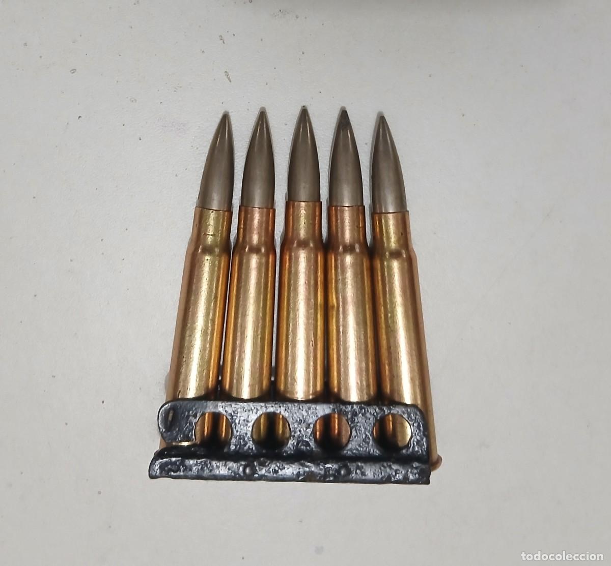 Militaria: Peine 7,7 mm Enfield con 5 cartuchos ingleses INERTES y percutidos. Guerra Civil.