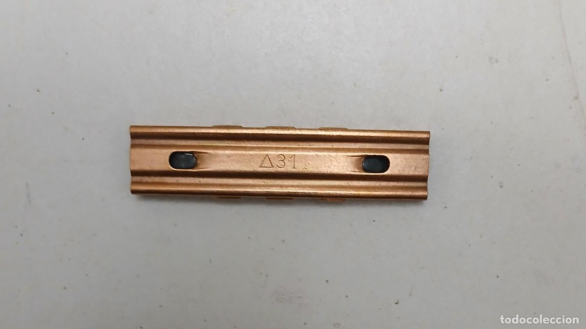 Militaria: Peine de 7,92 mm guerra civil marcaje Tri&aacute;ngulo 31. De lat&oacute;n.