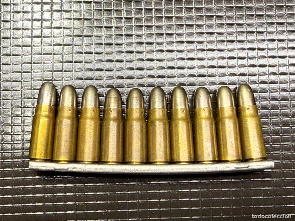 Militaria: Peine completo con 10 cartuchos calibre 7,63 x 25 Mauser Inerte.