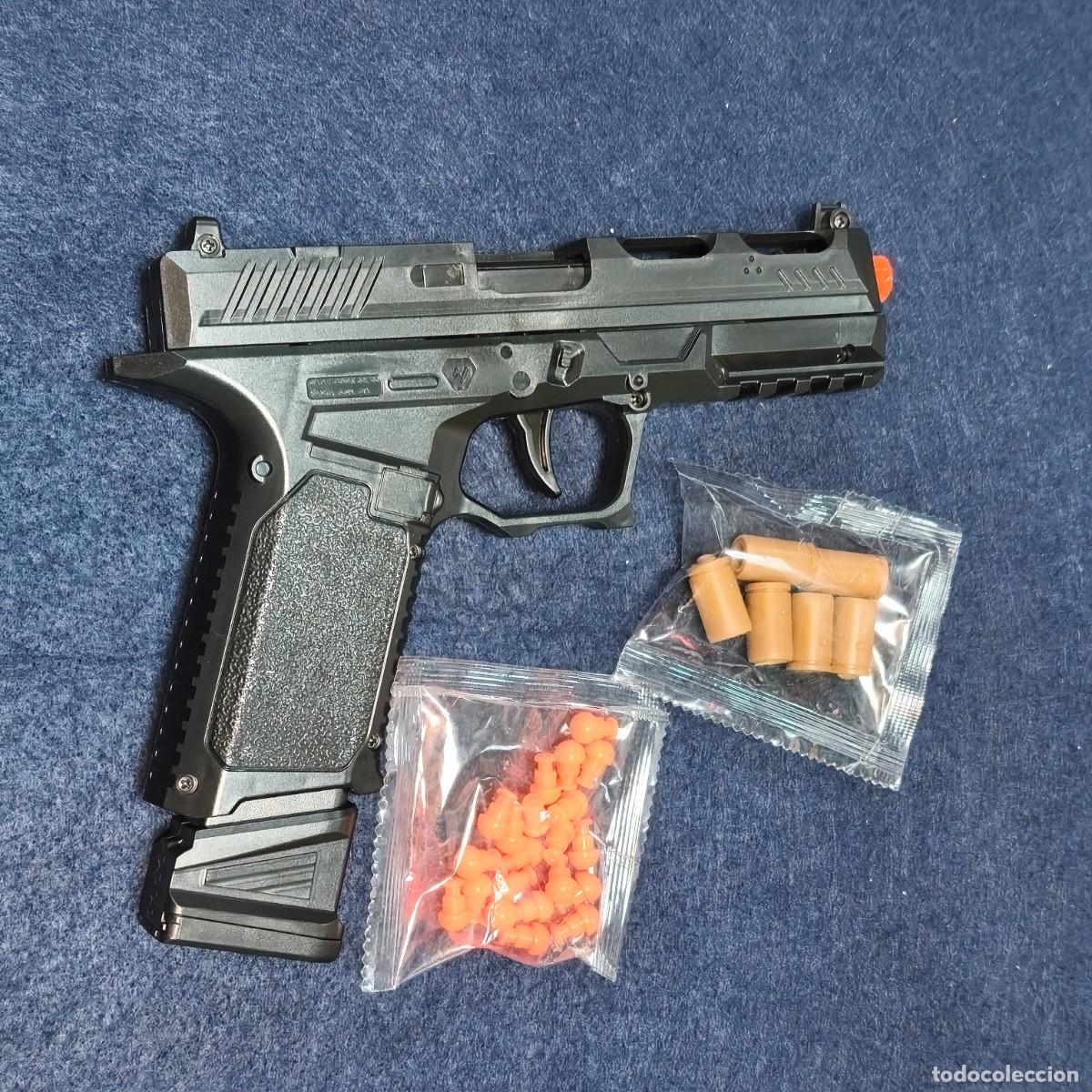 Militaria: PISTOLA AUTOMATICA STRIKE INDUSTRIES NEGRA CON MUNICION DE ESPUMA. COMPLETA Y REALISTA.
