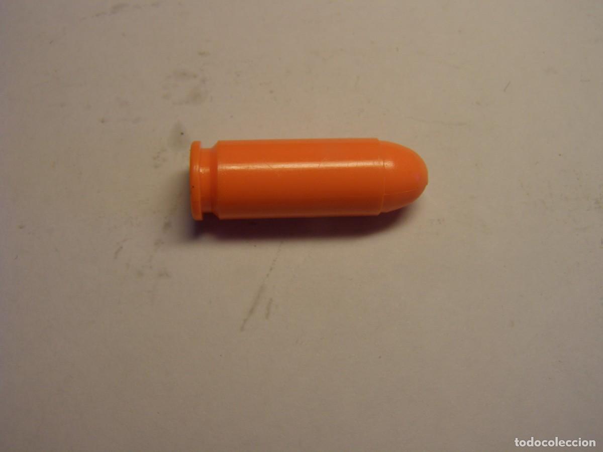 Militaria: Cartucho inerte, alivia percutores, calibre 10 MM. AUTO.